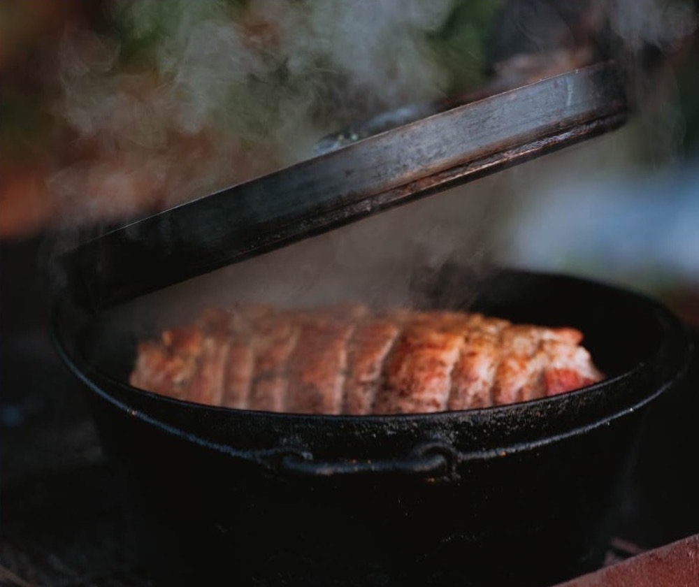 Cooking over the fire in the on-site kitchen